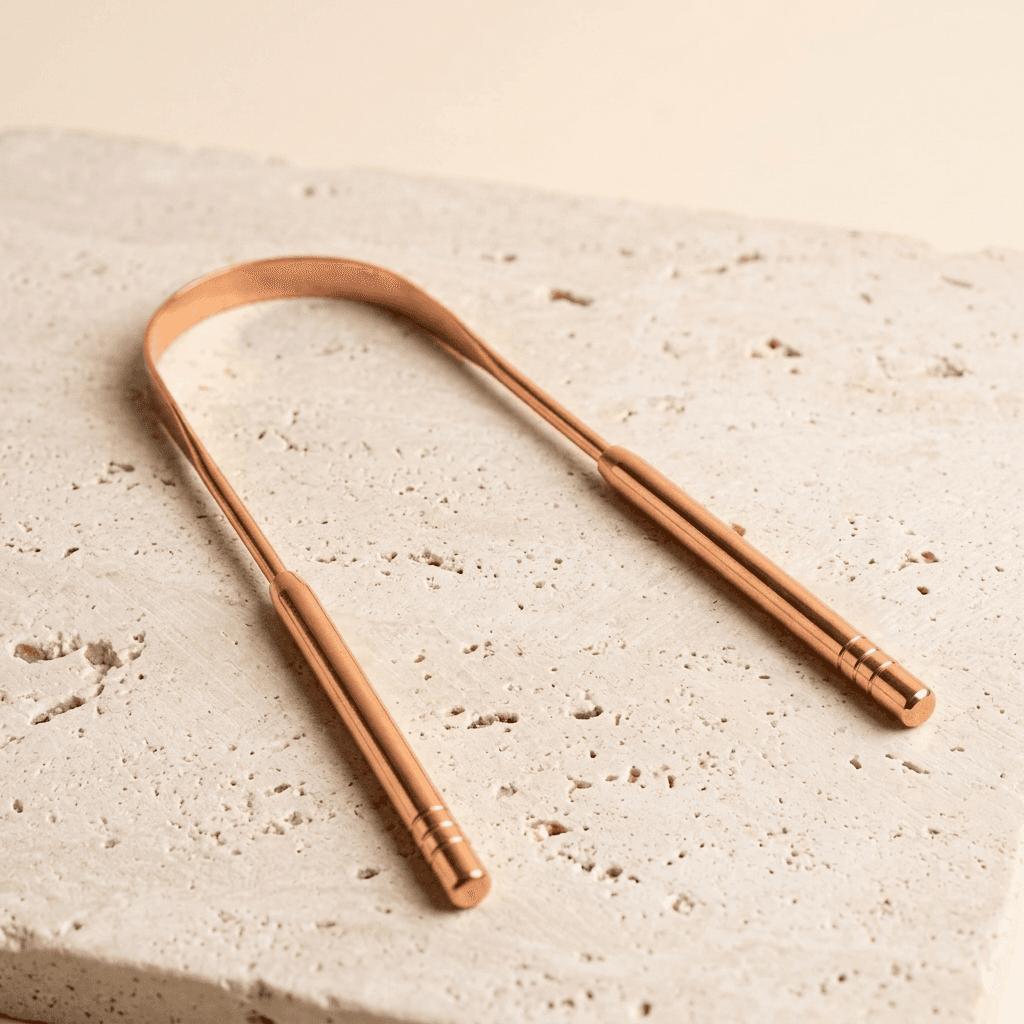 Raspador lingual de cobre